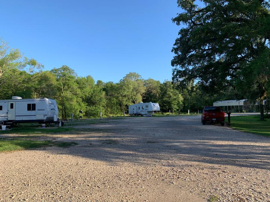 Wide gravel drive running past the RV sites